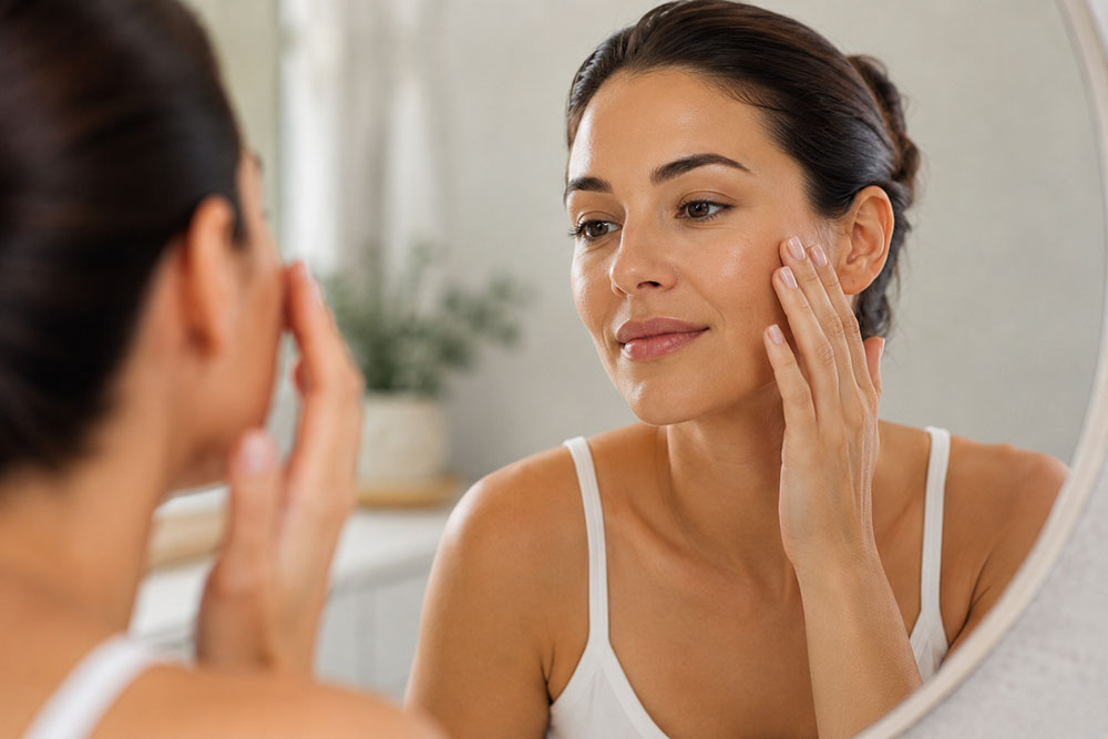 Client looking in mirror at Liva Beautyscape